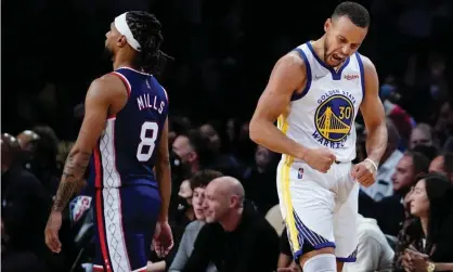  ?? Photograph: Frank Franklin II/AP ?? Stephen Curry (30) celebrates as Brooklyn Nets' Patty Mills (8) walks away during the second half of the Warriors’ win over the Nets.