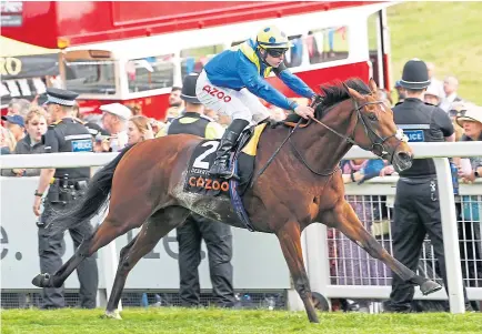  ?? ?? RUTHLESS: Richard Kingscote and Desert Crown were runaway winners in the Derby yesterday.
