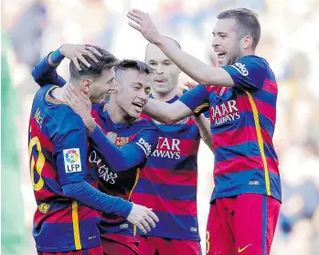  ?? MANU FERNANDEZ/THE ASSOCIATED PRESS ?? FC Barcelona’s Neymar, second from left, celebrates with teammates after scoring a goal during Saturday’s match against Getafe at the Camp Nou stadium in Barcelona.