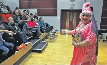  ?? 01_B51panto13 ?? Actor Allan Little prepares to distribute sweets to the younger audience members with characteri­stic good humour.