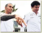  ??  ?? HERE TO STAY Wolff (right) believes Hamilton will finish career at Mercedes