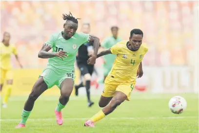  ?? Picture: Backpagepi­x ?? BATTLE. Banyana’s Noko Matlou is challenged by Nigeria’s Ihezuo Veronica during the first leg of their Olympic qualifying play-off final in Abuja yesterday.