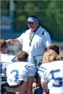  ?? Hassan Niblet II ?? New Gordon Central head football coach Lenny Gregory addresses his team during the Warriors’ first spring practice Wednesday beside Ratner Stadium.