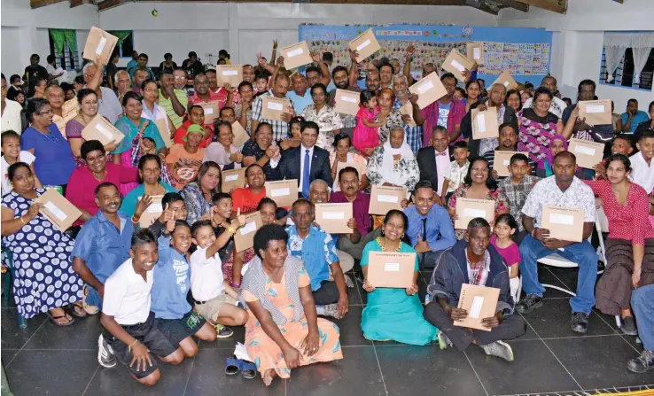  ?? Photo: Vilimoni Vaganalau ?? Acting Prime Minister and Attorney-General Aiyaz Sayed-Khaiyum and the Minister for Industry, Trade, Tourism, Lands and Mineral Resources Faiyaz Koya with the families of Omkar Road, Narere on September 13, 2017.