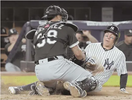  ?? AP PHOTO ?? STOPPED SHORT: The Yankees’ Ronald Torreyes is tagged out at home by White Sox catcher Omar Narvaez during last night’s game in New York. The Yankees lost, 6-2, to fall 61⁄2 games behind the Red Sox in the AL East.