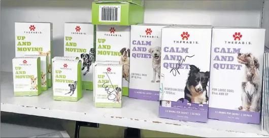  ?? AP PHOTO ?? Marijuana products for dogs are lined up on a shelf in the Bend Veterinary Clinic in Bend, Ore., in a 2017 file photo.