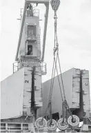  ?? Godofredo A. Vasquez / Houston Chronicle ?? Workers unload a steel shipment at the Port of Houston Turning Basin General Cargo Terminal.