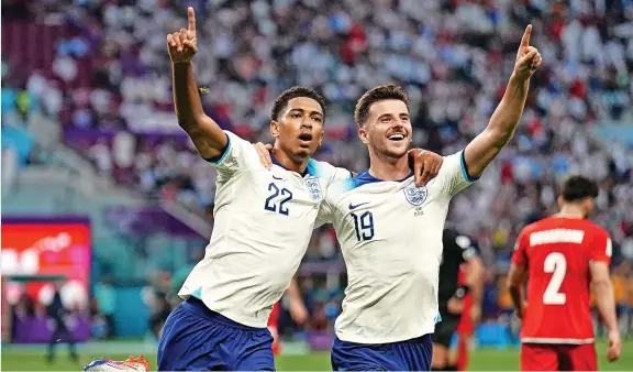  ?? Mike Egerton ?? England’s Jude Bellingham celebrates scoring their side’s first goal of the game with team-mate Mason Mount in the World Cup opener with Iran