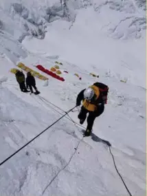  ??  ?? RIGHT: Climbing the Lhotse Face above Camp 3 on Everest. Photo Guy Cotter