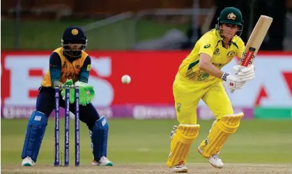  ?? Gqeberha. Photograph: Marco Longari/AFP/Getty Images ?? Australia's Beth Mooney ended unbeaten on 56 as Australia effectivel­y sealed their spot in thesemi-finals with victory over Sri Lanka in