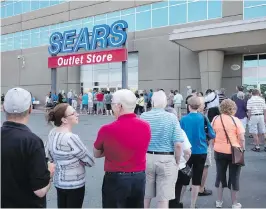  ?? CP ?? Shoppers wait for a Sears outlet store to open in Halifax on Friday.