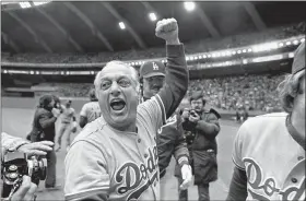  ?? ASSOCIATED PRESS FILE ?? Dodgers manager Tom Lasorda celebrates after his team beat the Montreal Expos for the National League Pennant in 1981. Lasorda died Jan. 8 of a heart attack.