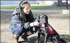  ?? GROUP GARY REYES / BAY AREA NEWS ?? Patsy Hayes, 21, bonds with her service dog, Andromeda, during a training session at Willow Street Frank Bramhall Park in San Jose, Calif. Hayes suffers from a severe allergy to latex products which has sent her to countless trips to the emergency room...
