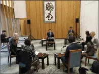  ?? (AP/Eugene Hoshiko) ?? Japan’s Prime Minister Fumio Kishida (center) speaks Friday at the Prime Minister’s official residence in Tokyo during an interview with foreign media members ahead of an official visit to the United States.