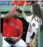  ?? ELISE AMENDOLA — THE ASSOCIATED PRESS ?? David Ortiz, left, high-fives with Aly Raisman, U.S. Olympic gold medalist in gymnastics, before she threw a ceremonial first pitch prior to Friday’s game.