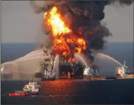  ??  ?? Fiery seas: The Deepwater Horizon rig ablaze after the explosion