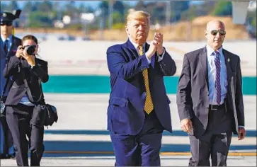  ?? Gina Ferazzi Los Angeles Times ?? PRESIDENT TRUMP departs Air Force One on Tuesday at LAX. In August, he sued to block a California law that would require him to disclose five years’ worth of tax returns to appear on the state’s primary ballot.