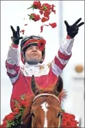  ?? Robert Goddin ?? Sonny Leon aboard Rich Strike celebrates winning the 148th running of the Kentucky Derby at Churchill Downs.