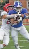  ?? STAFF PHOTO BY C. B. SCHMELTER ?? McCallie’s B. J. Harris fights for extra yards as Brentwood Academy’s Casen Calmus tries to bring him down on Sept. 4. McCallie, the reigning TSSAA Division II-AAA champion, lost 30-27 to visiting BA that night.