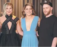  ?? Picture: MEAGAN HARDING ?? Katie Brennan and Melissa Hickey get styled up for Brownlow with Justin Lancaster.