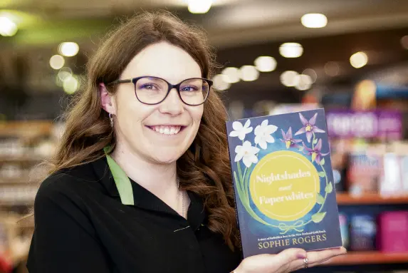  ?? PHOTO: SHANNON THOMSON ?? Labour of love . . . Alexandra woman Sophie Rogers holds her first novel which was released last week.