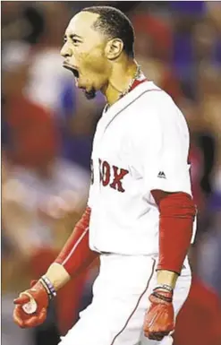  ?? GETTY ?? Mookie Betts celebrates after hitting game-winning, two-run double in 9th to defeat St. Louis at Fenway Park on Wednesday.