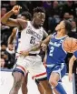  ?? Jessica Hill/Associated Press ?? Seton Hall’s Al-Amir Dawes (2) is guarded by UConn’s Adama Sanogo in the first half Saturday in Storrs.