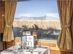  ?? AFP ?? Linen, crystals and silverware are seen in the dining car as Blue Train approaches the Karoo area.