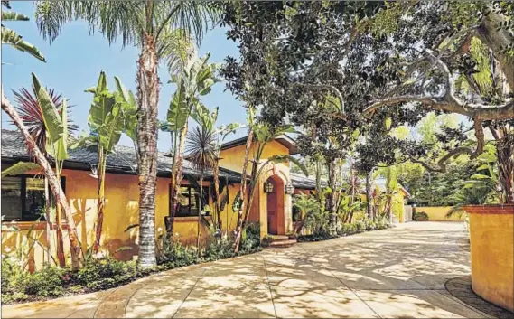  ?? Photograph­s by Alexis Adams ?? THIS MEDITERRAN­EAN-STYLE estate has been home to R&B singer Eric Benet and is now owned by Fall Out Boy’s Pete Wentz.