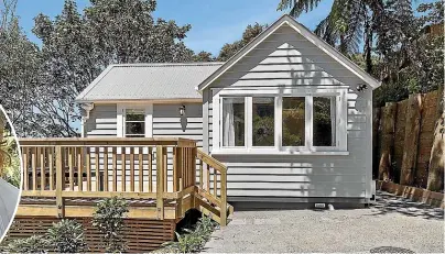  ?? LOWE & CO REALTY ?? Above, despite an abundance of native bush, the wee house gets allday sun; left, the 34 square-metre house was bought for just $18,000, but then the real work started.