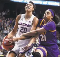  ?? Jessica Hill / Associated Press ?? ECU’s Salita Greene, right, fouls UConn’s Olivia Nelson-Ododa during Saturday’s AAC quarterfin­al game at Mohegan Sun Arena.