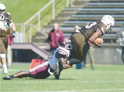  ?? AMY SHORTELL/THE MORNING CALL ?? Lehigh’s Jalen Burbage gets tripped up while running the ball against Fordham on Saturday in Bethlehem.