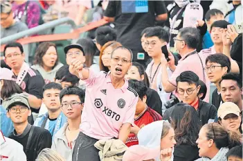  ?? — AFP photo ?? Fans react after not seeing Inter Miami’s forward Lionel Messi play after the friendly football match between Hong Kong XI and US Inter Miami CF in Hong Kong.