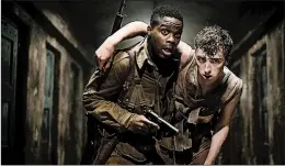  ?? PARAMOUNT PICTURES ?? Jovan Adepo, left, and Dominic Applewhite try to survive World War II Nazis in the J.J.Abrams-produced “Overlord.”