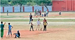  ?? —DC ?? Children play cricket at the Parade Ground on Friday.