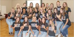  ?? DESTIN DAVIS/THE Saline Courier ?? The Benton High School Panther Cheer Team shows off their state championsh­ip rings after being honored with Panther Pride awards at Monday night’s school board meeting.