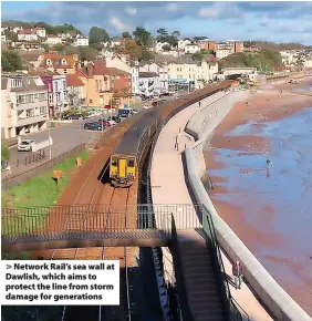  ?? ?? Network Rail’s sea wall at Dawlish, which aims to protect the line from storm damage for generation­s