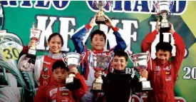  ??  ?? TRS karters Julia delos Angeles, Wils Casequin, AT Tuason, Jarred Kim and Flynn Jackes display their trophies.