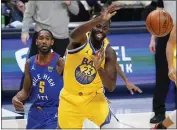  ??  ?? Warriors forward Draymond Green, front, passes the ball as Nuggets forward Will Barton defends in the second half on Thursday. The Nuggets won 114-104.