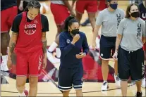  ?? JOHN LOCHER — THE ASSOCIATED PRESS ?? Head coach Dawn Staley, center, coaches during practice for the United States women’s basketball team in preparatio­n for the Olympics on July 13 in Las Vegas.