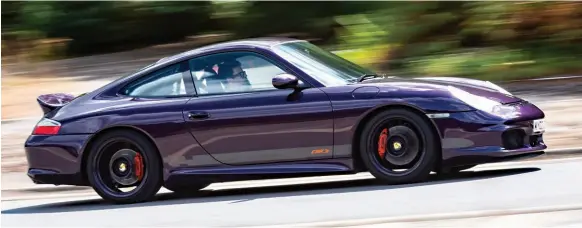  ??  ?? Eye poppng Audi Merlin Purple comes alive in the sunlight and gives the 996based machine a new lease of life