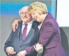  ??  ?? Higgins is declared elected and congratula­ted by his wife Sabina during the announceme­nt of the results of the Irish presidenti­al elections in Dublin. — Reuters photo