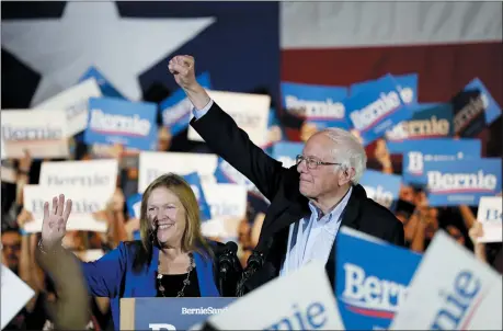  ?? ERIC GAY — THE ASSOCIATED PRESS ?? Democratic presidenti­al candidate Sen. Bernie Sanders, I-Vt., right, with his wife Jane, speaks during a campaign event Feb. 22in San Antonio.