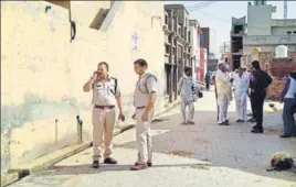  ?? HT PHOTO ?? Police near the crime spot at Gorakhpur village of Fatehabad district on Monday.