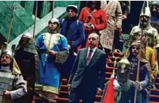  ?? AP ?? Turkish President Recep Tayyip Erdogan with honour guards wearing historic Turkish warrior costumes last year as he welcomed visiting Palestinia­n counterpar­t Mahmoud Abbas.