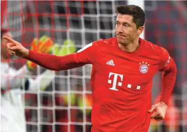  ??  ?? Bayern's Robert Lewandowsk­i celebrates after scoring his side's fourth goal during the German soccer cup, DFB Pokal, match between FC Bayern Munich and TSG Hoffenheim in Munich, Germany, Wednesday, Feb. 5, 2020. (AP Photo/Matthias Schrader)