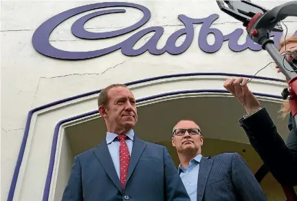  ?? PHOTO: FAIRFAX NZ ?? Labour leader Andrew Little, left, and Dunedin North MP David Clark talk to media outside Dunedin’s Cadbury factory.