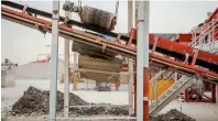  ??  ?? MAMMOTH OPERATION... The rolling magnet removes ferrous materials from rocks, cement and bricks at the specialise­d plant.