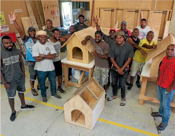  ?? CHLOE RANFORD/ STUFF ?? RSE workers in front of the three dog kennels they built.