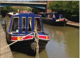  ?? PHOTOS BY SHAWN PRICE ?? Boats are moored in the Oxford Canal in Banbury, Oxfordshir­e. The canal was built in 1790 as an avenue for trade between London and the Midlands. Now it’s a scenic waterway.